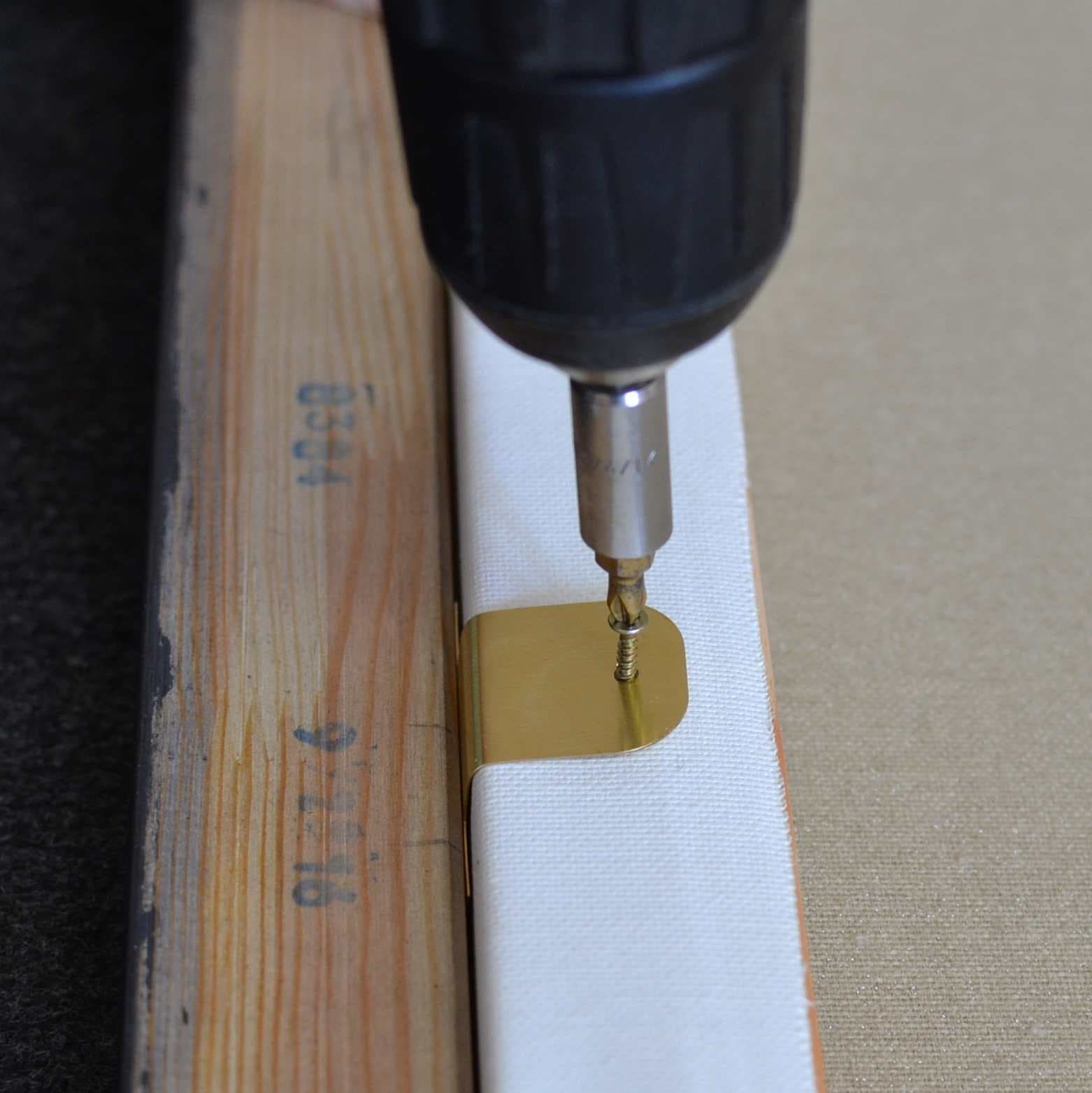 Securing the artwork and mounting the hangers